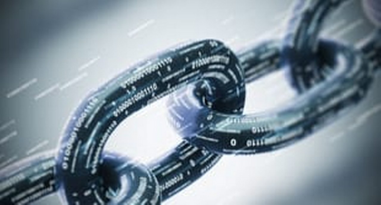 a chain in front of a grey background