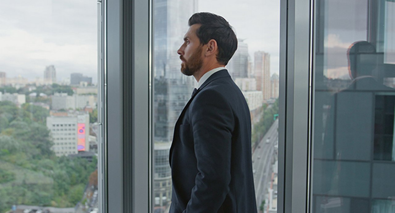 Man standing near a window