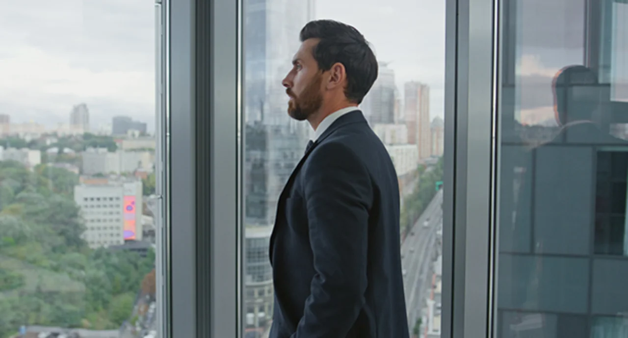 Man standing near a window