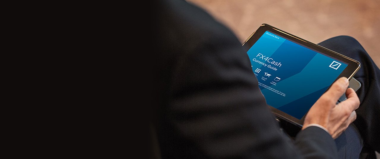 business man holding a tablet displaying the FX4Cash App