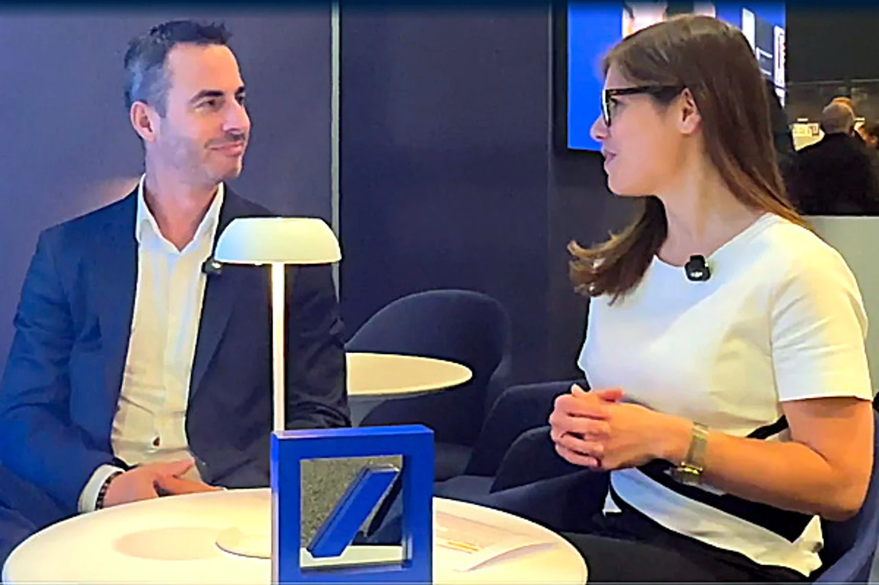 Oliver Lens and Desirée Buchholz discussing at Sibos