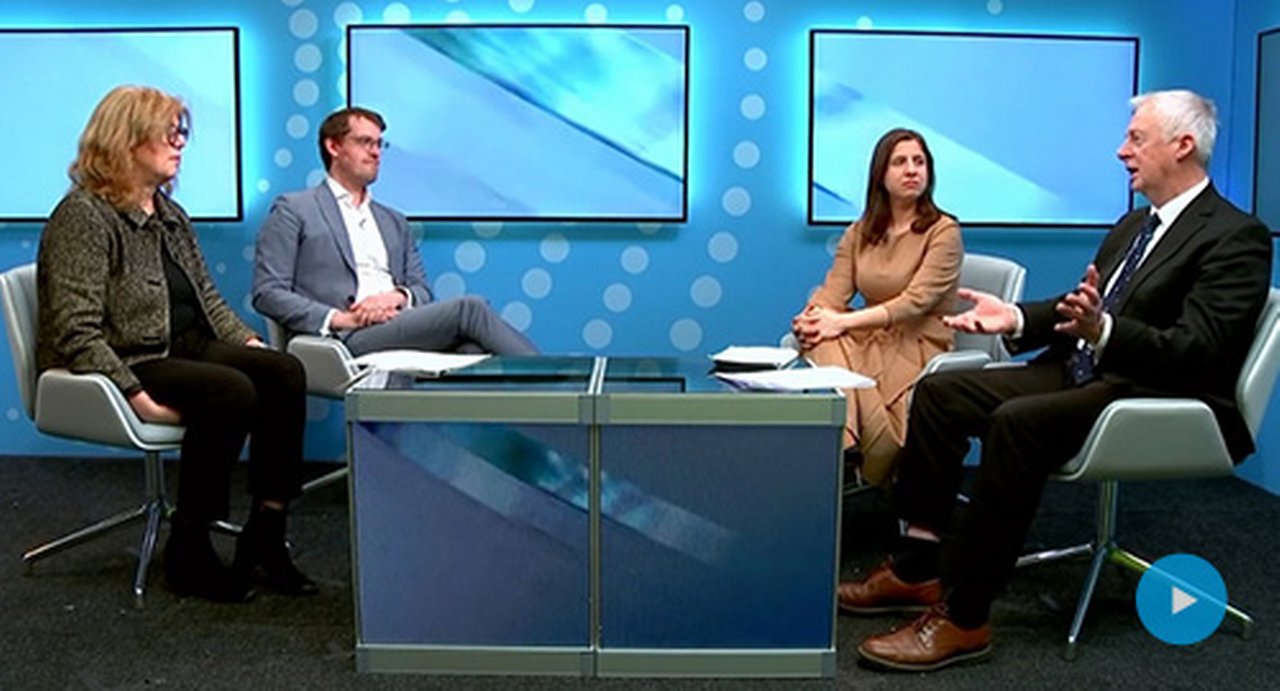 people discussing around a table in the Trade Finance TV