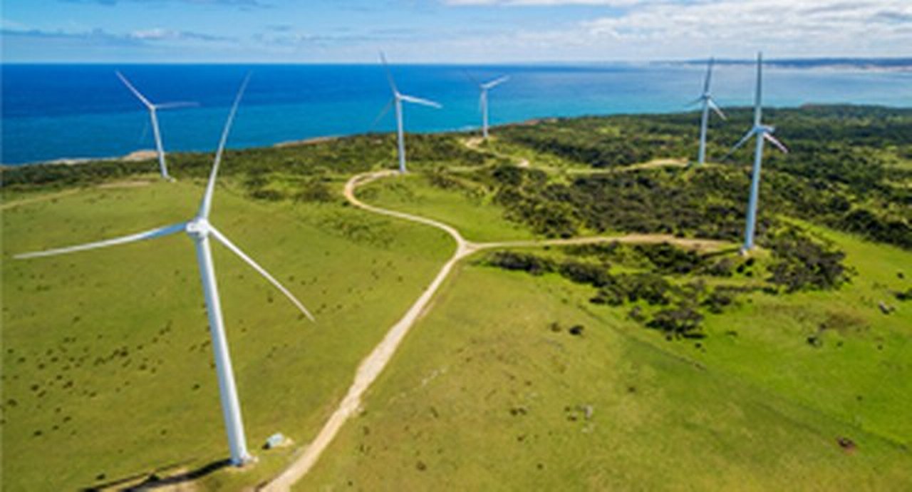 Aerial view of wind farm in rural area on bright sunny day in Australia