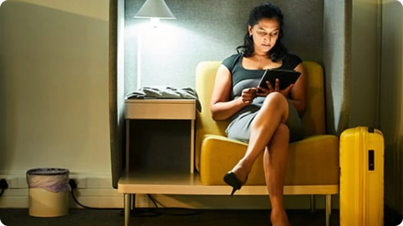 Woman in a chair with a tablet