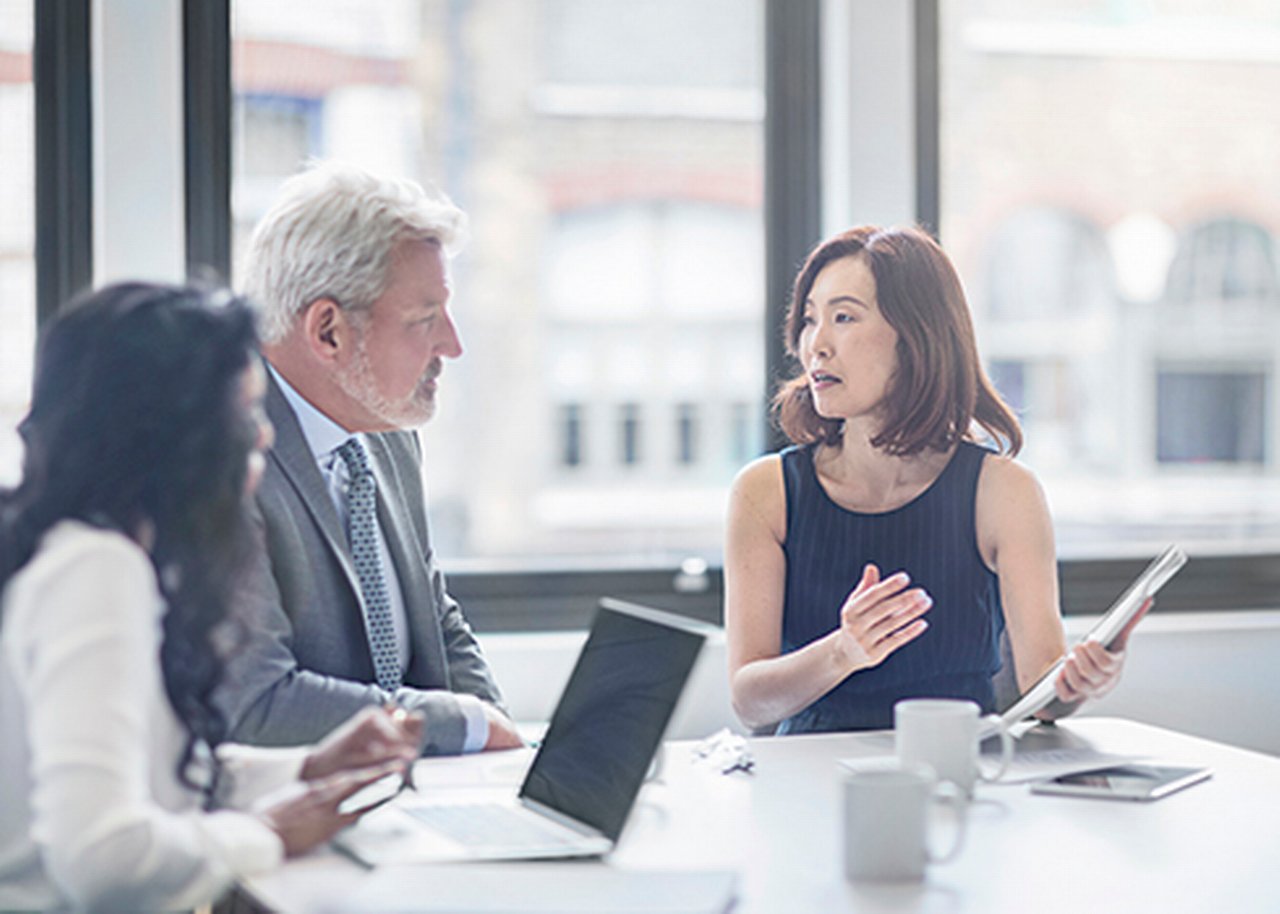 An international team discusses with an interpreter