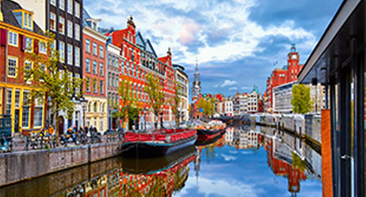 Amsterdam water way with buildings on both sides