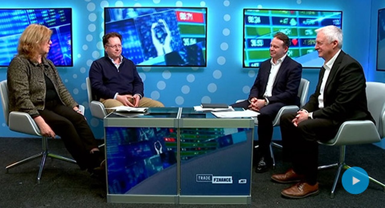 people discussing around a table in the Trade Finance TV