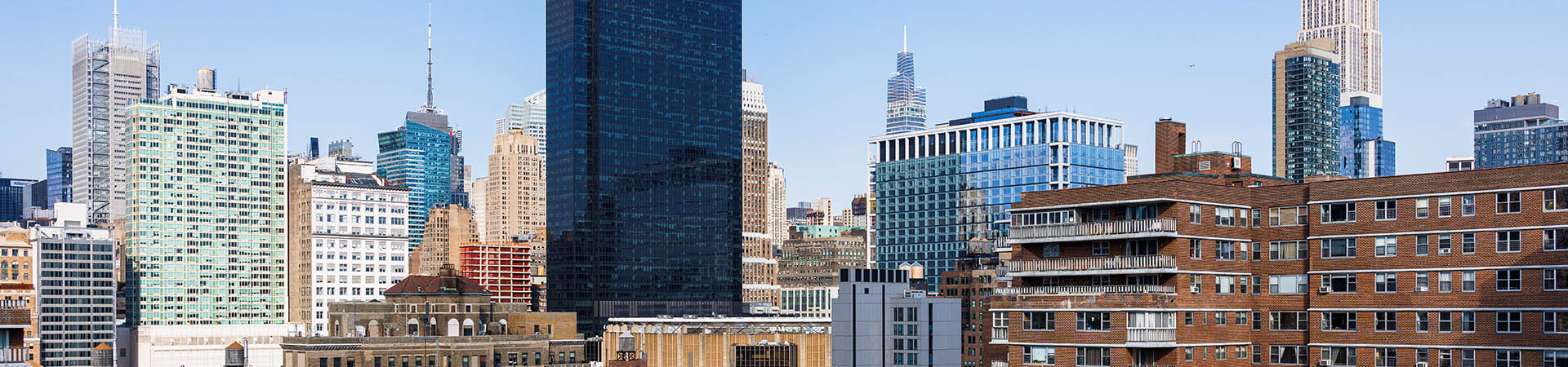 Empire State Building Towers Over Midtown Historic Brownstones Meet Modern Skyscrapers Across New York City Skyline