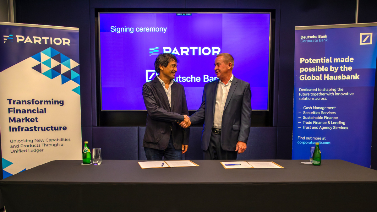 Partior CEO Humphrey Valenbreder and David Lynne, Head of Corporate Bank, Deutsche Bank sign the platform agreement